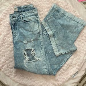 Like new acid washed light distressed denim jeans with wide leg